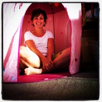 Playing in a pink princess tent