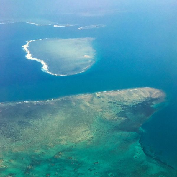 Heart shaped island below on our flight to our daughter's destination wedding in paradise