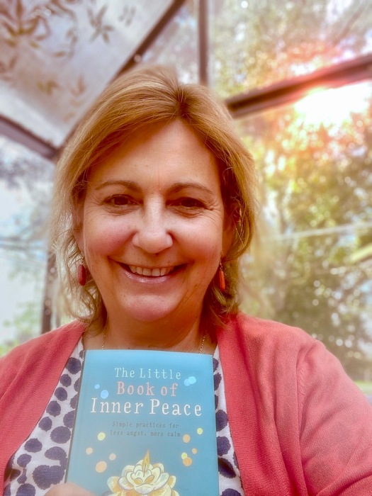 Debbie with the travelling book of Inner Peace