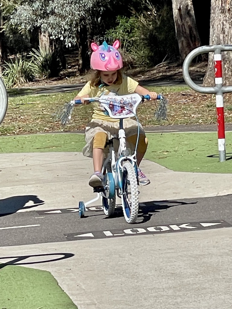 Emilia riding her bike